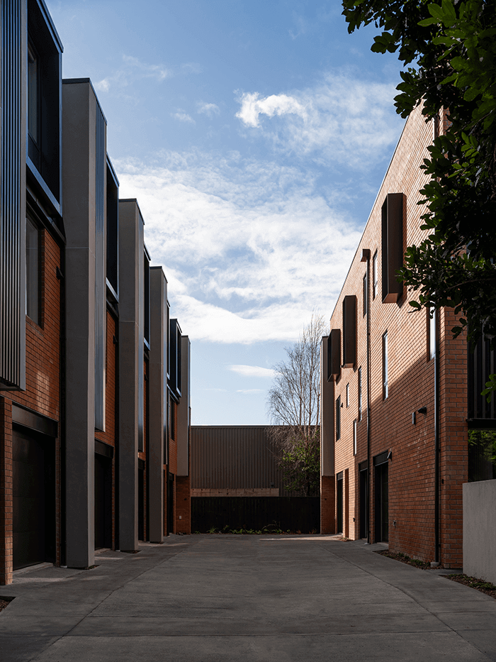 Mesa Morningside Auckland townhouses east side crafted in industrial looking clay brick and black metal