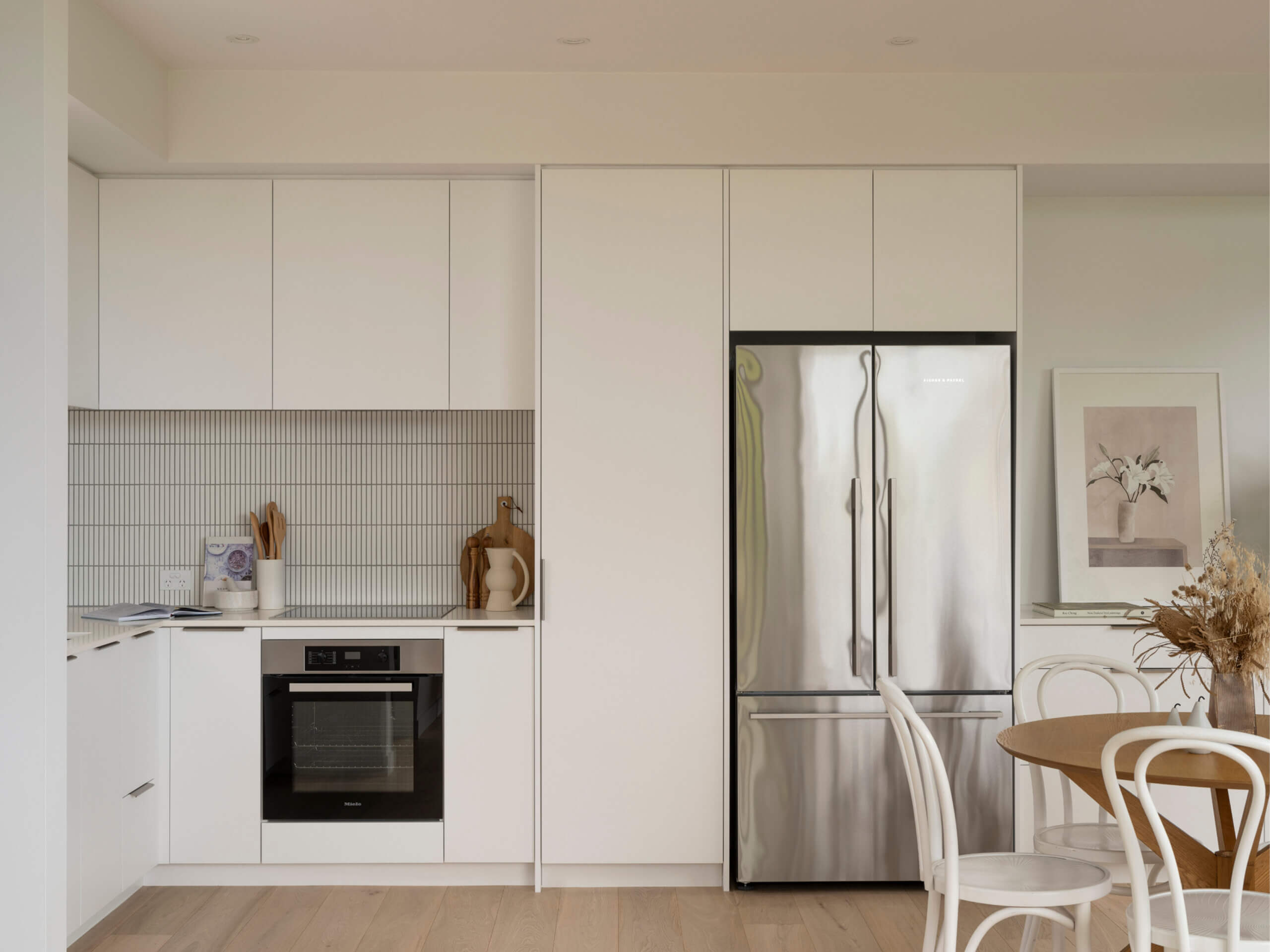 Open plan modern kitchen with Miele appliances in Mesa Morningside Auckland townhouses