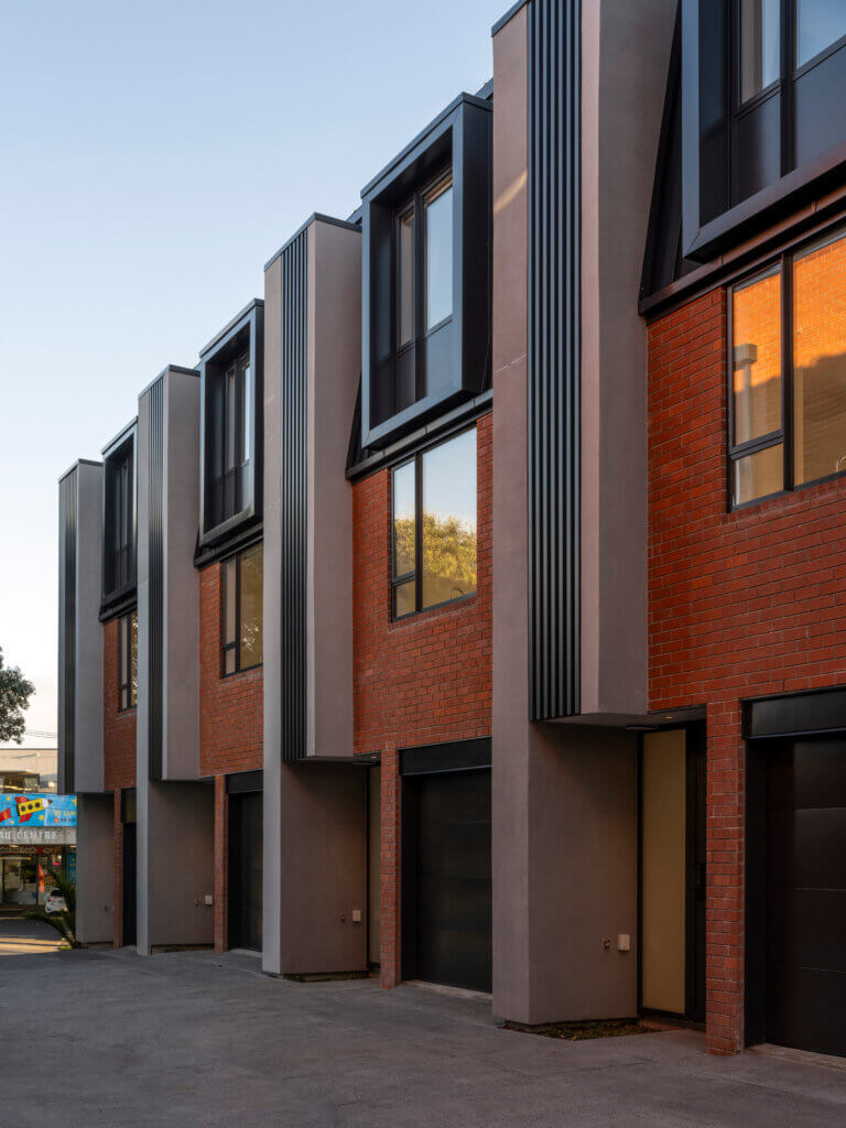 Mesa Morningside Auckland townhouses exterior crafted in industrial looking clay brick and black metal