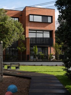 Mesa Morningside Auckland city multi-unit terrace developments crafted in clay brick and black metal side view